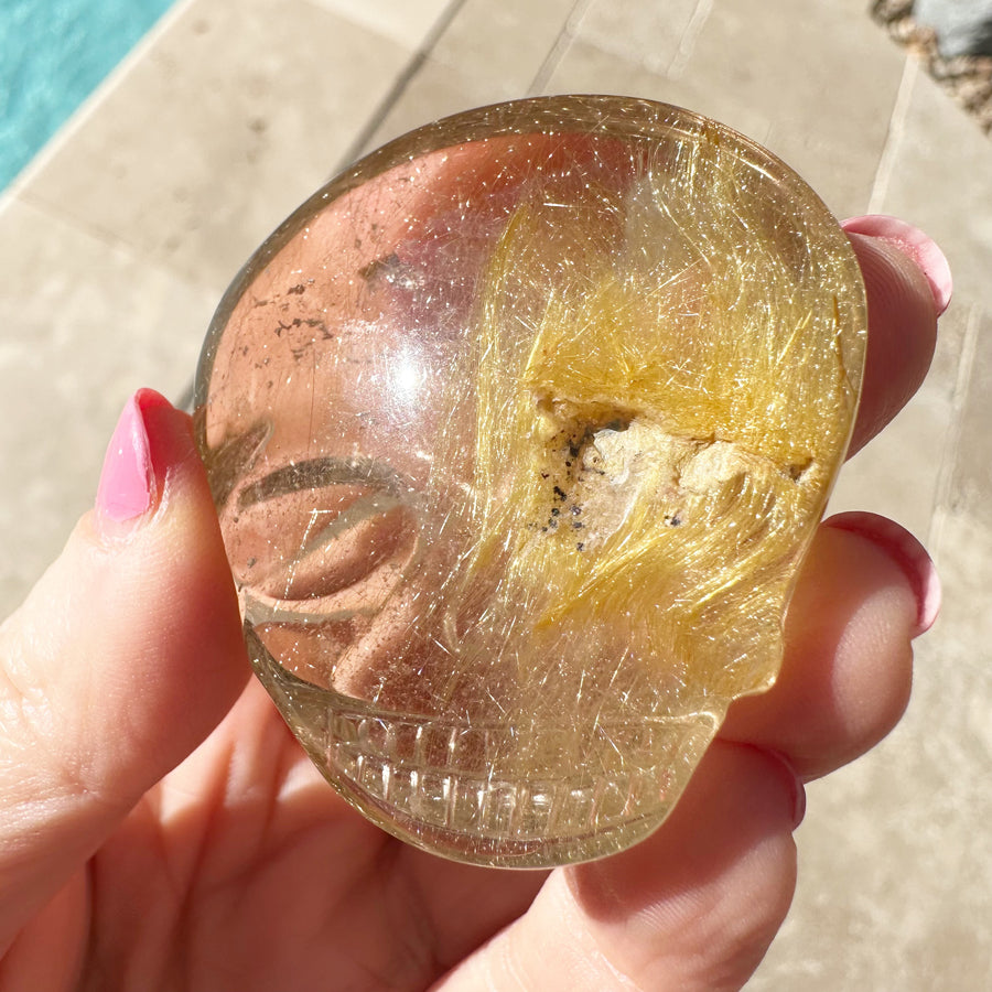 Golden Rutile Quartz Palm Crystal Skull Carved by Leandro de Souza