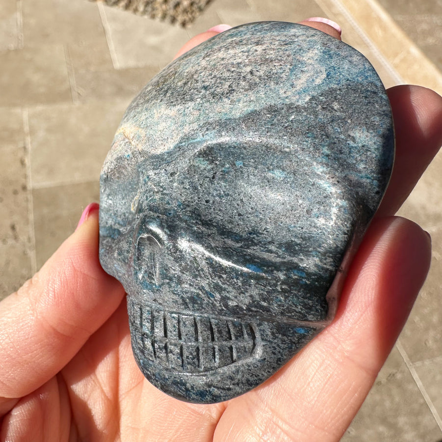 Blue Richterite Palm Crystal Skull Carved by Leandro de Souza