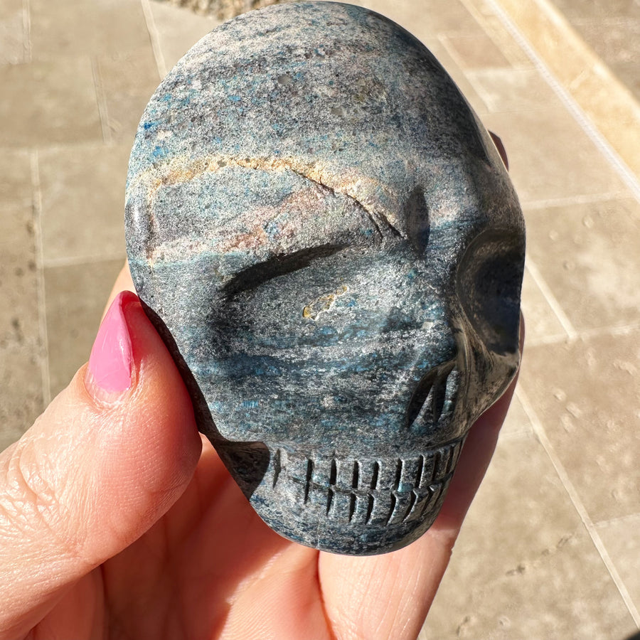 Blue Richterite Palm Crystal Skull Carved by Leandro de Souza