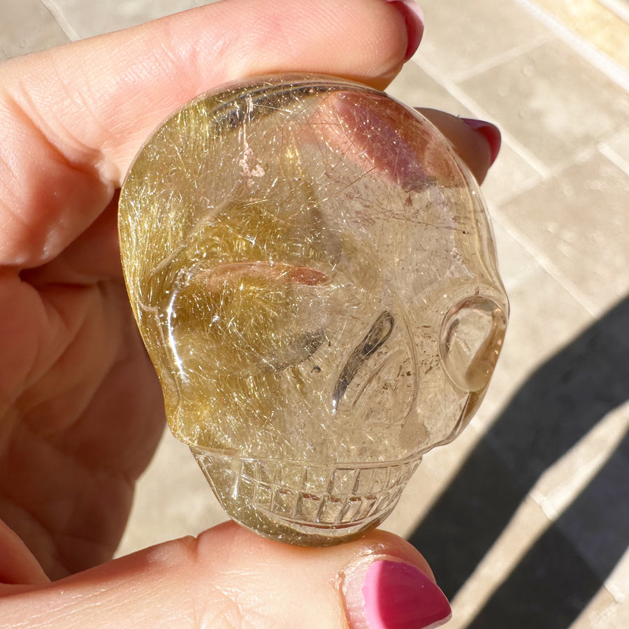 Golden Rutile Quartz Palm Crystal Skull Carved by Leandro de Souza